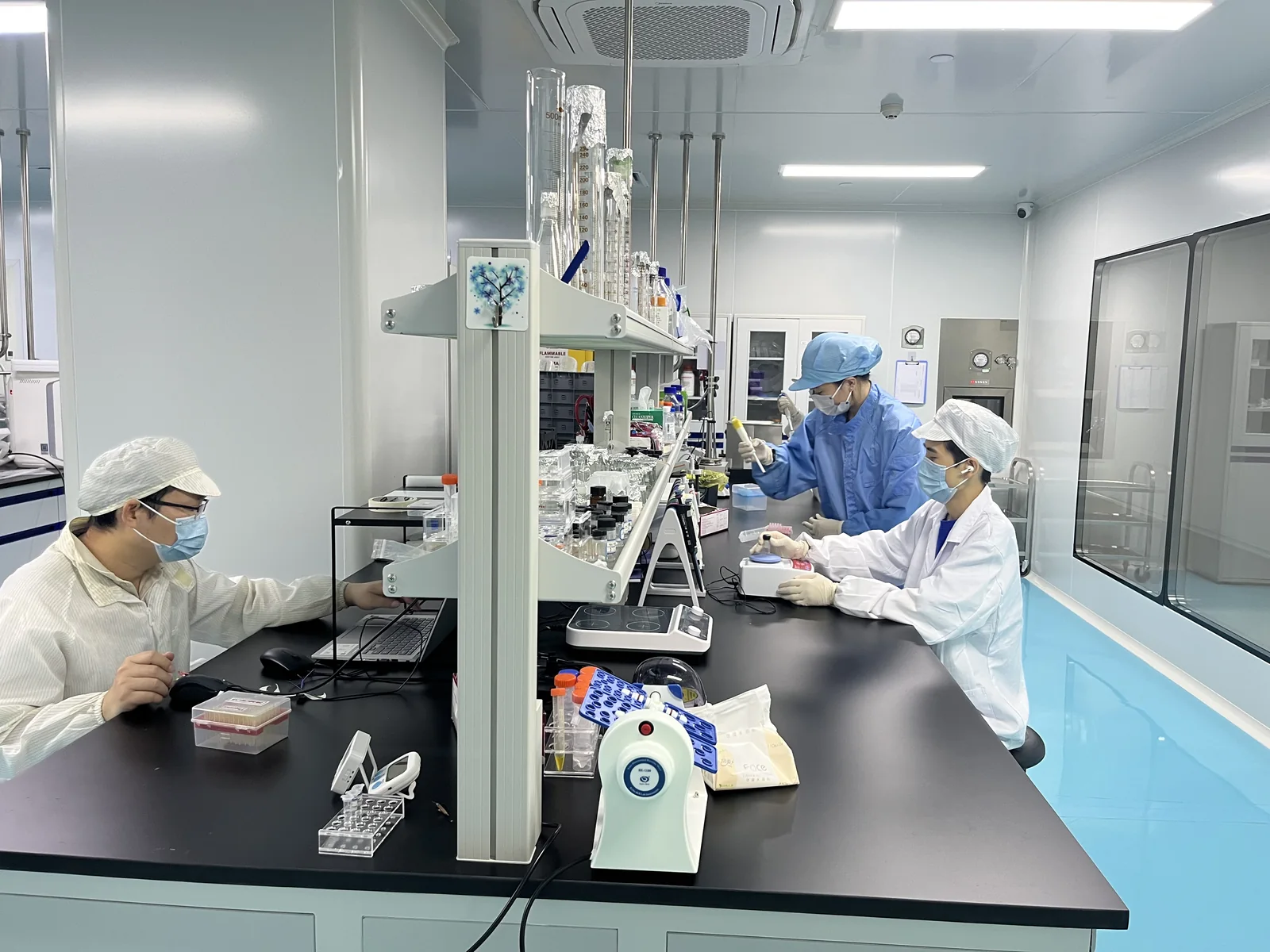 Engineers working at the sensor development bench in the Shenzhen laboratory
