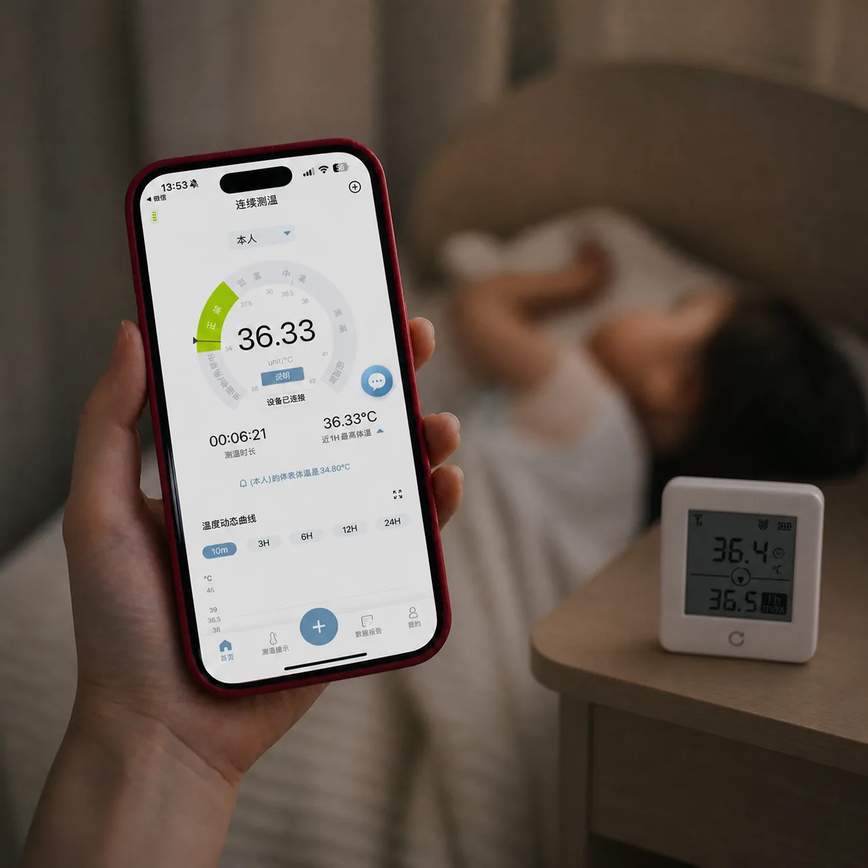 P20 bedside temperature monitor on a side table while a caregiver follows the same continuous body temperature reading in the phone app