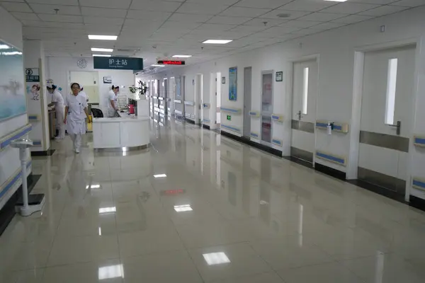 Ward corridor view toward the shared nursing display area at Beijing 306 Hospital