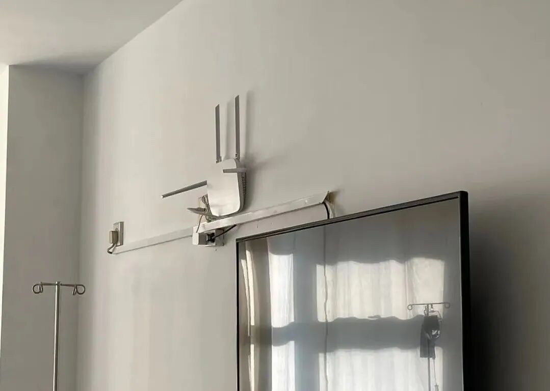 Bluetooth gateway installed above the patient-room display at Beijing 306 Hospital