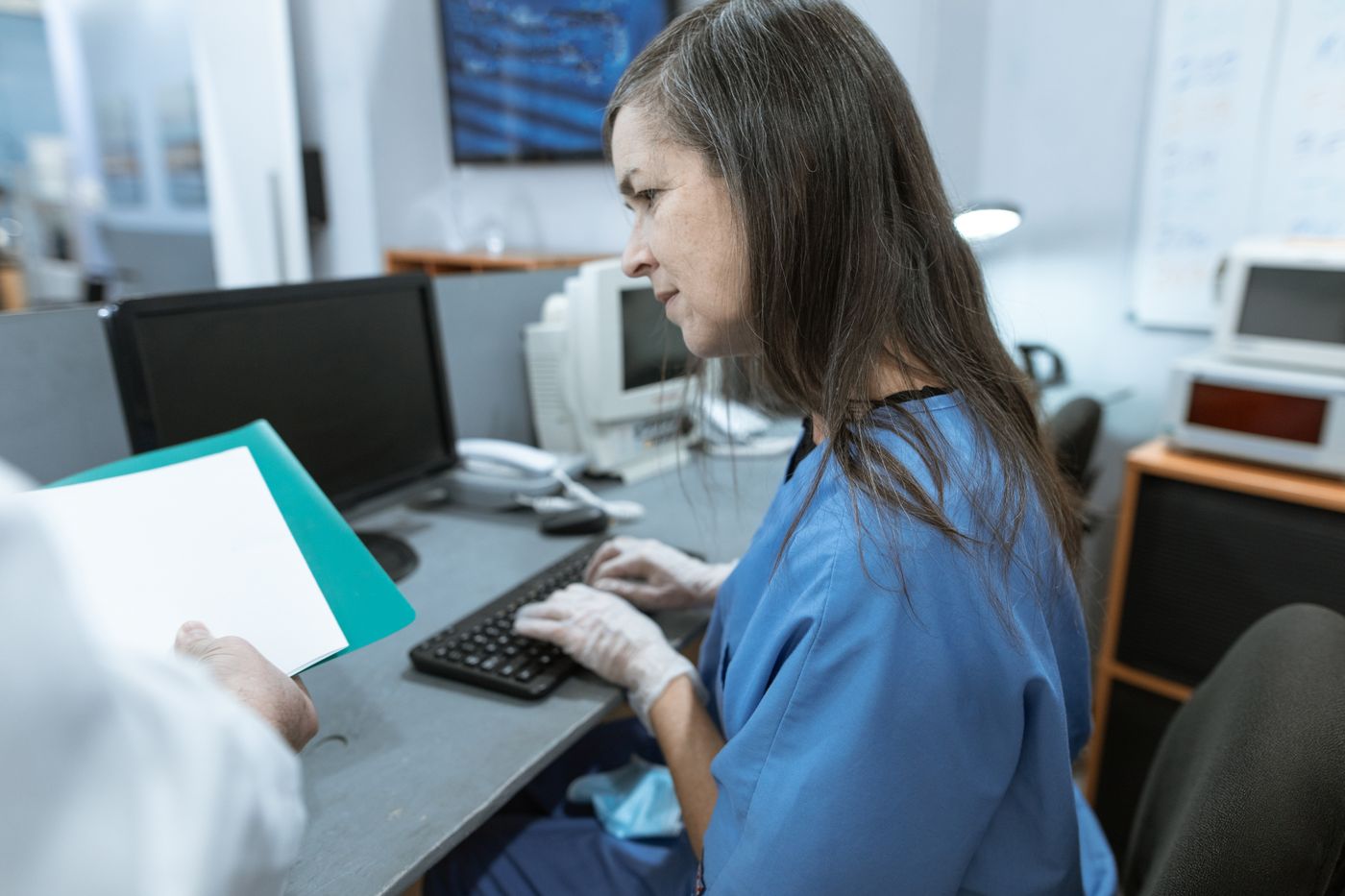Nurses working at the station desk rather than walking a round